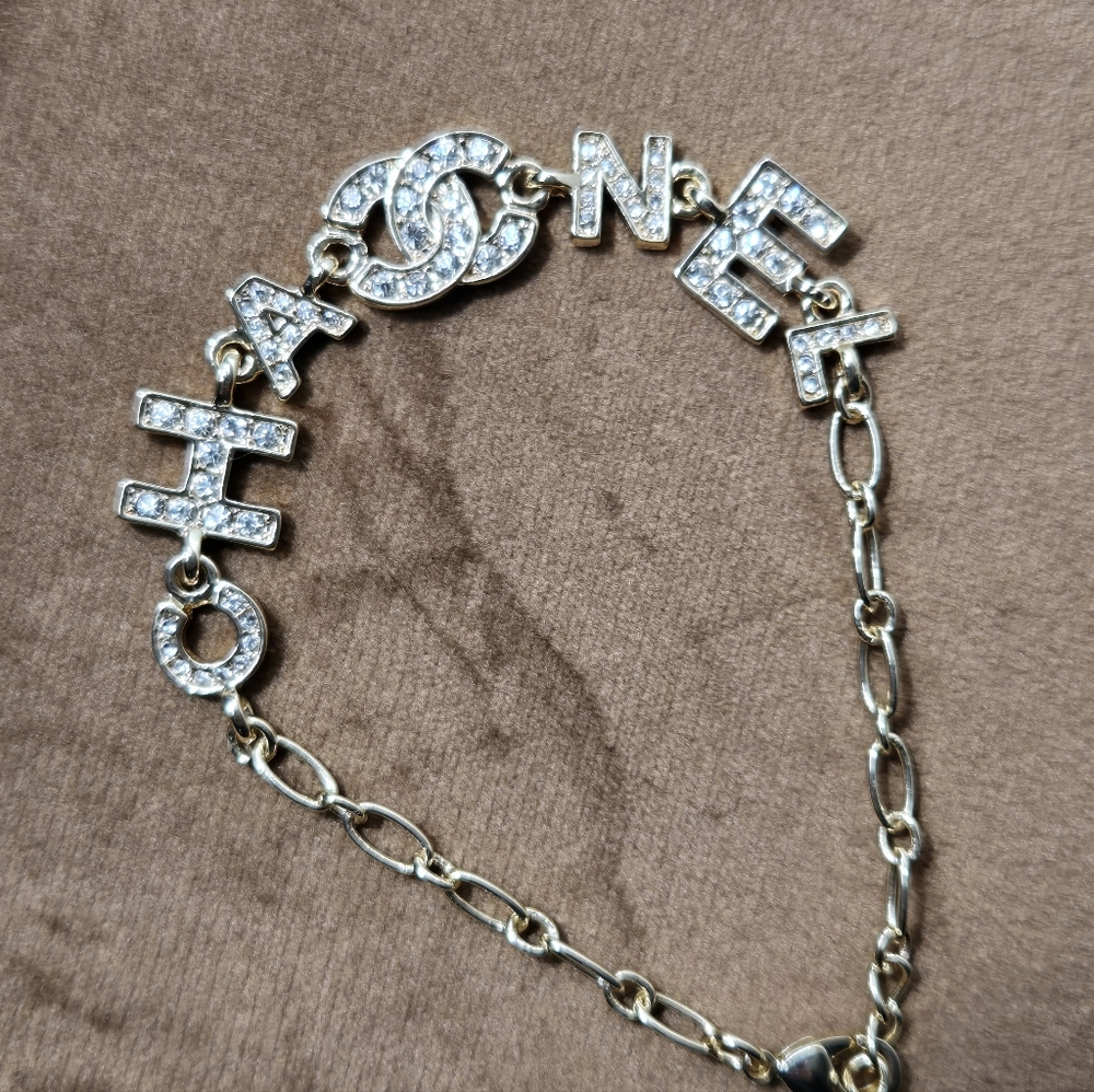 Gold Tone Logo Bracelet With Rocks - Picture 2 of 14